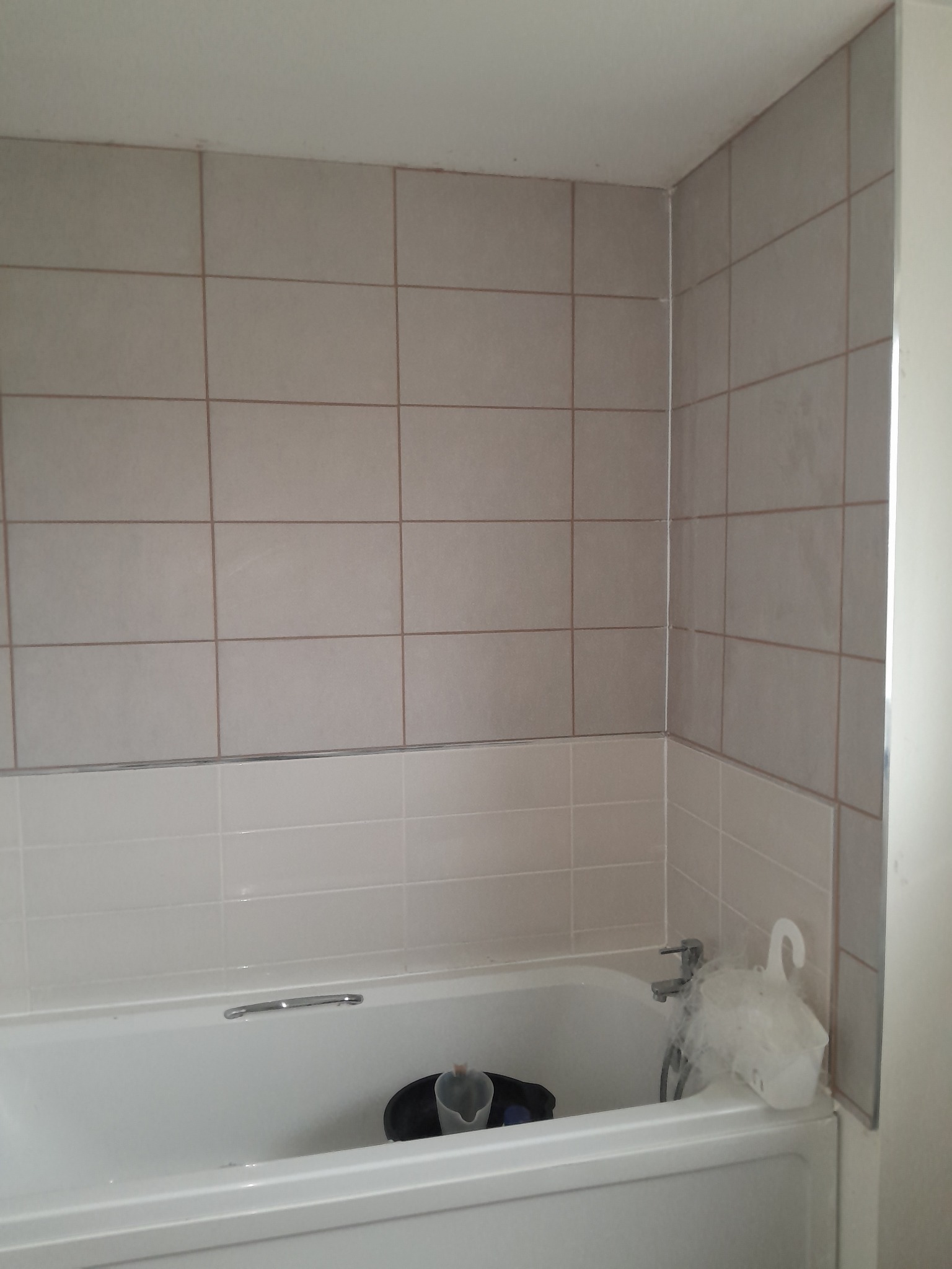 Finished large-format bathroom wall tiles in Bathgate