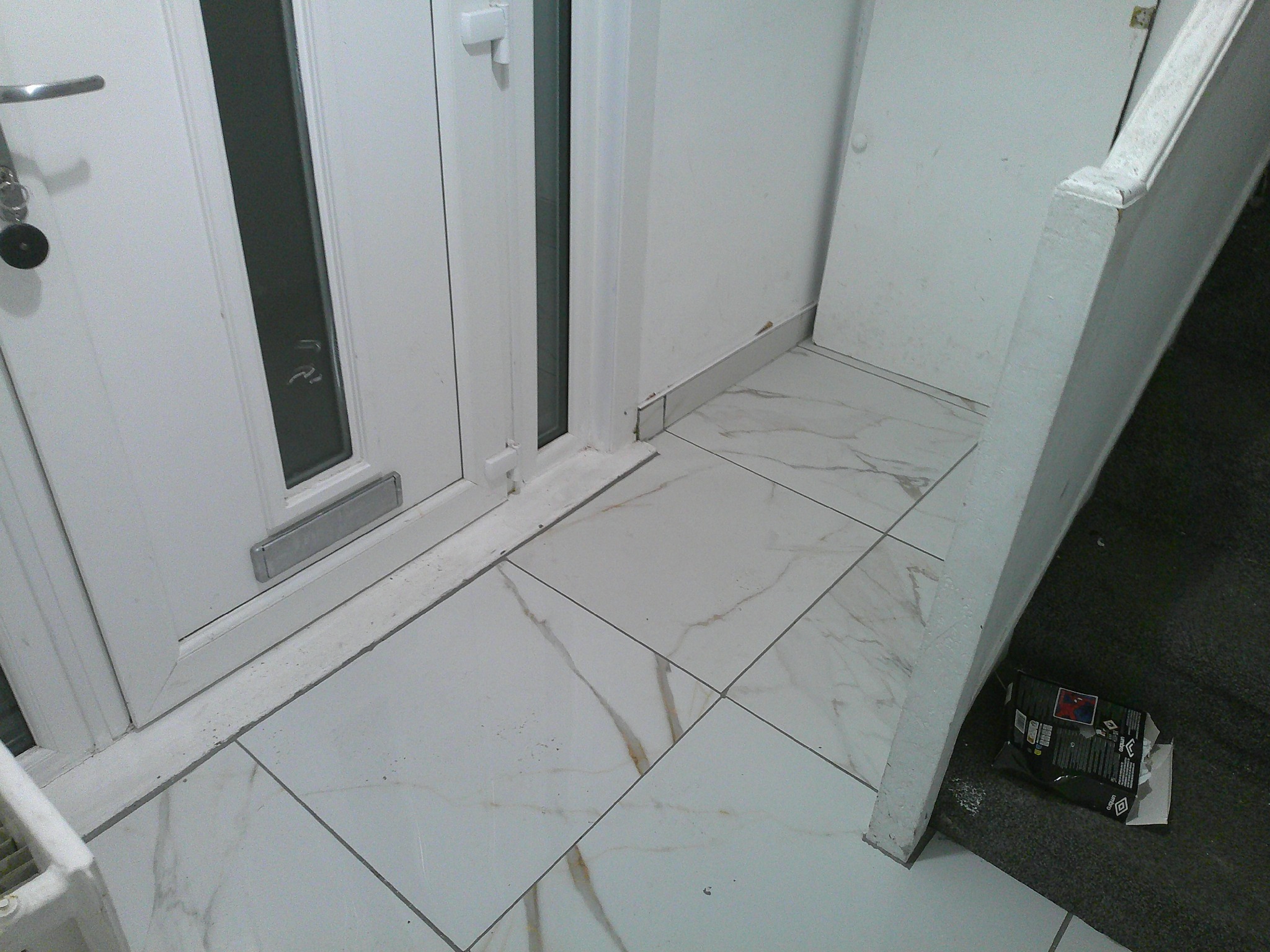 Finished marble-effect floor tiling detail