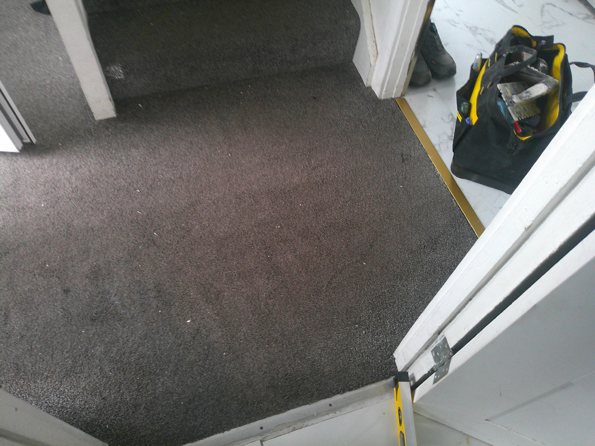 Carpeted entrance before floor tiling by Herringbone of Lanark