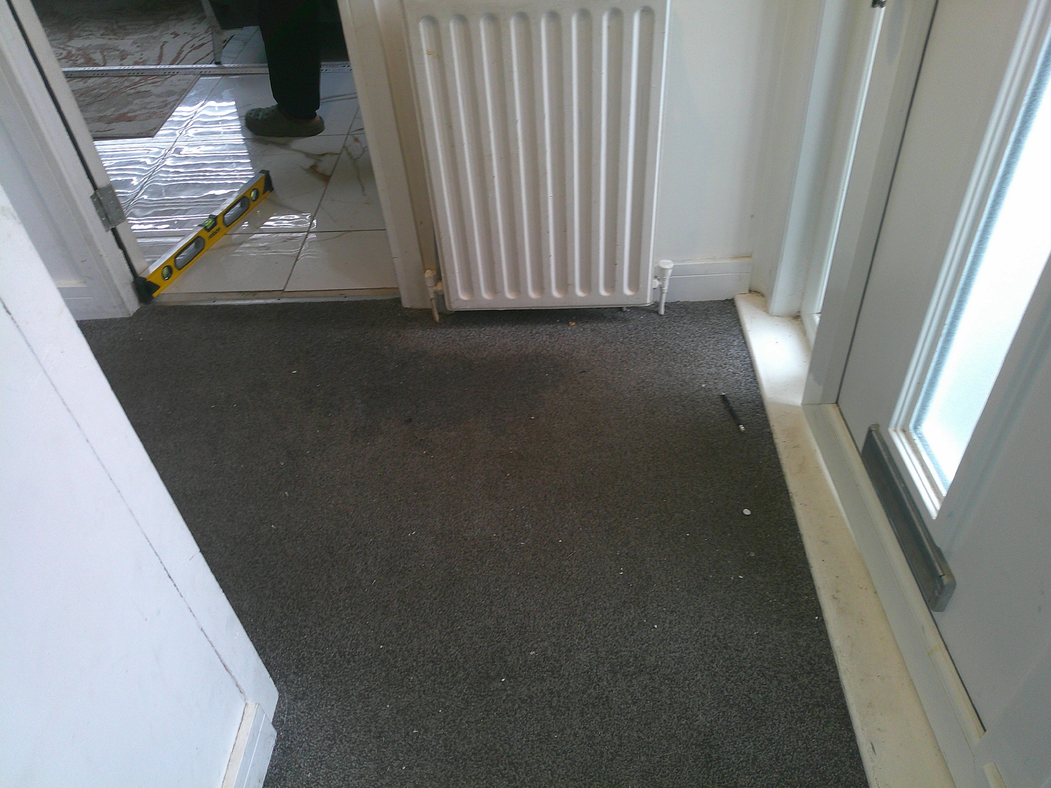 Hallway before marble-effect floor tiling